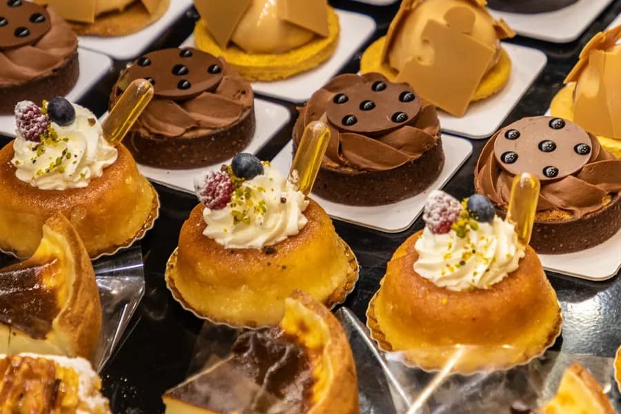 A tray of By Eric pastries lined up in the display case