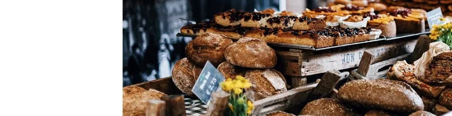 Loaves of freshly baked bread stacked on the By Eric counter